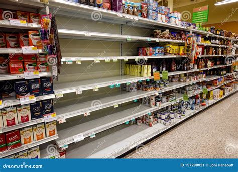 Empty Grocery Store Shelves Of Bottled Water Before A Hurricane Or Snow