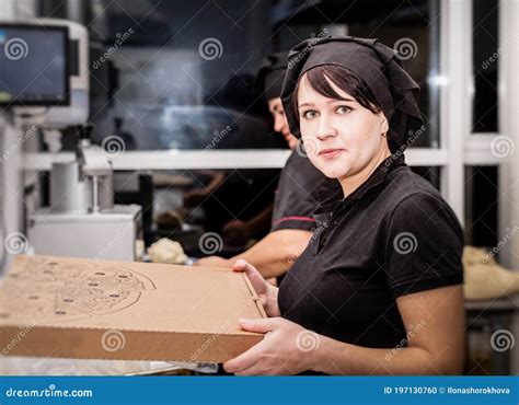 Bakers in Black Uniform at the Pizzeria Kitchen Working on Order Stock Photo - Image of cook ...