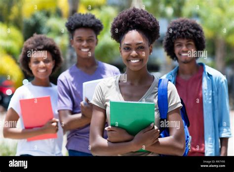 African female student with group of african american students outdoor ...