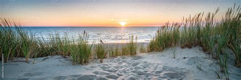 Sunset at the dune beach Stock Photo | Adobe Stock