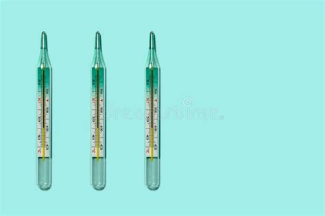 Three Medical Mercury Thermometers In A Row Close Up Flat Lay Stock