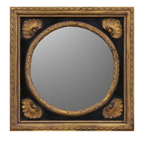 an ornate gold framed mirror on a white background