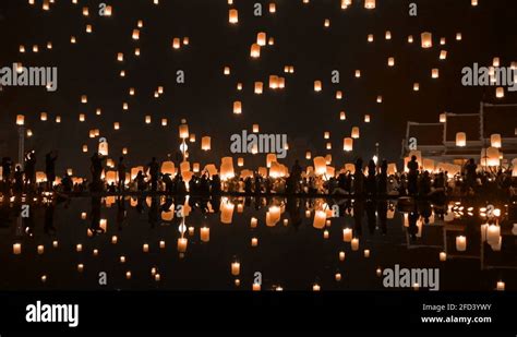 Thai People Release Sky Floating Lanterns Or Lamp To Worship Buddhas