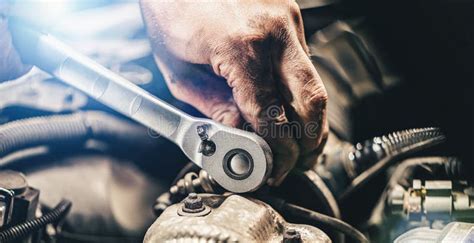 Auto Mechanic Hands Working On Car Engine In Mechanics Garage Repair