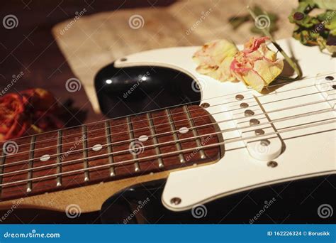 Electric Guitar, Dried Flowers and Vintage Sheet Music Closeup ...