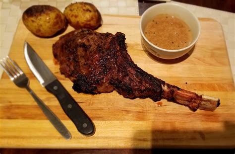 Homemade Tomahawk Steak With Peppercorn Sauce And Baked Potatoes Food