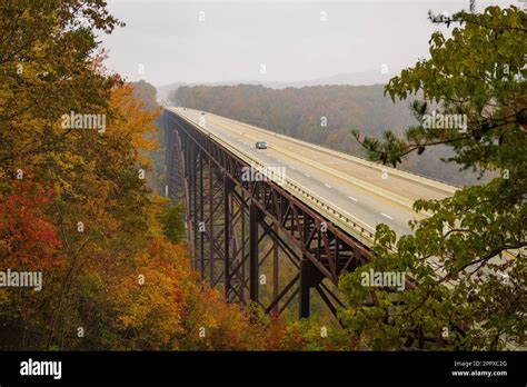 An aerial view of a colorful autumn landscape with a bridge in New River Gorge National Park ...