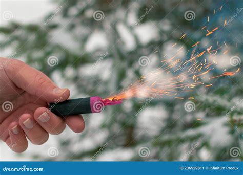 Burning Firecracker In A Hand Sparks And Smoke Of Petard Stock Image