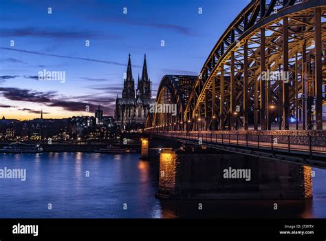 Cologne Cathedral Bridge at Night with the blue Sky Stock Photo - Alamy