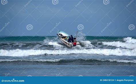 Fishing Boat Being Launched On The Beach Stock Photo Image Of Manabi