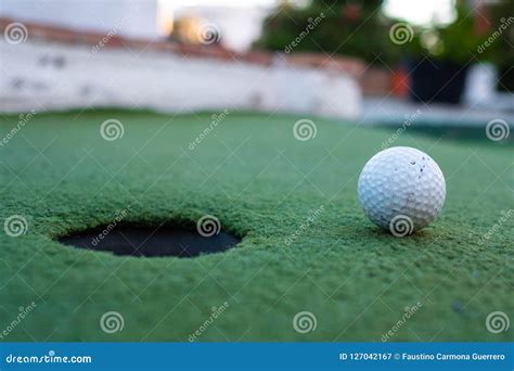 Golf Ball And Hole In A Minigolf Field Stock Image Image Of Golf