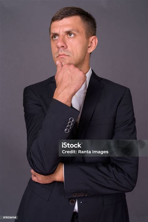 Handsome Businessman With Short Hair Against Gray Background Stock