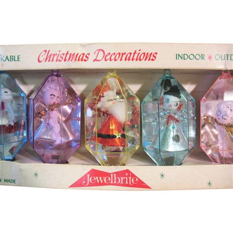 A Set Of Five Vintage Hard Plastic Jewelbrite Christmas Ornaments In