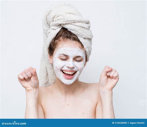 Pretty Woman With A Towel On Her Head Face Mask Naked Shoulders