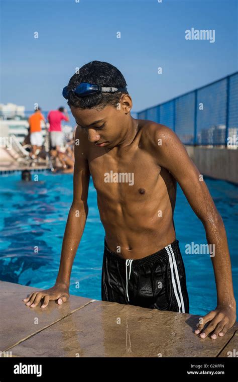 Teenage Boy Getting Out Of Swimming Pool Stock Photo Alamy