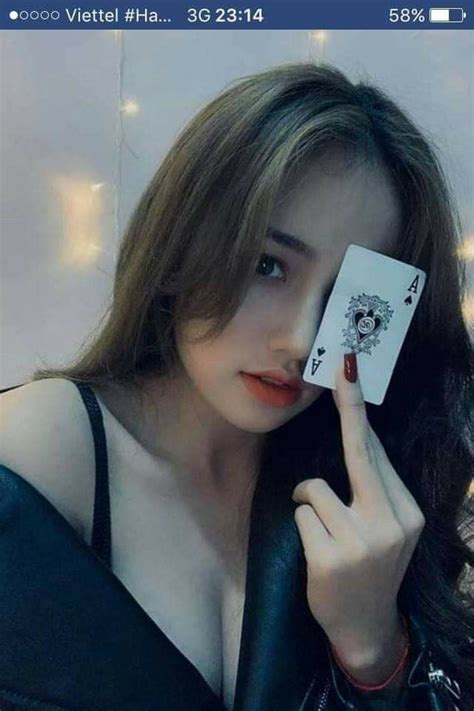 Woman Holding Playing Card