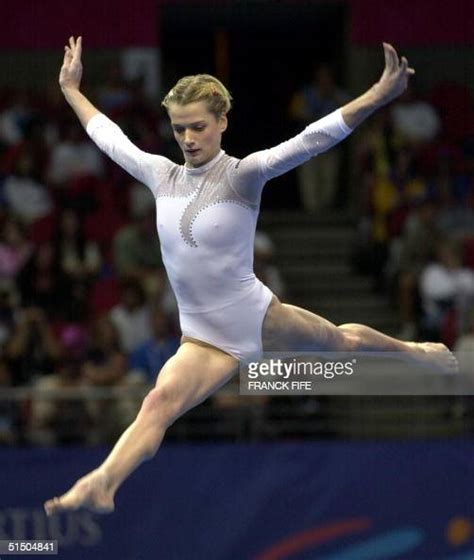 Svetlana Khorkina Of Russia Performs Her Routine On The Beam 17