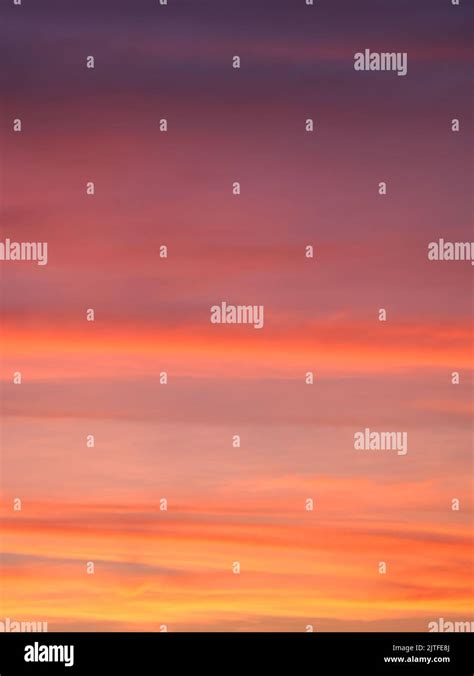 Vibrant Colorful Background Of Red Pink Purple Orange Clouds In Sunset Sky Blurry Dawn Sky Full