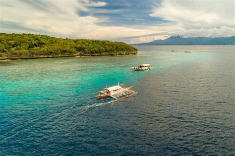 Aerial View Of Traditional Filipino Fishing Boats By Sumilon Island