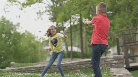 Kids Playing Water Balloon Fight Stock Footage Video (100% Royalty-free) 1054447682 | Shutterstock