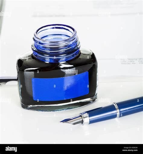 Photos of ink bottle and fountain pen Stock Photo - Alamy