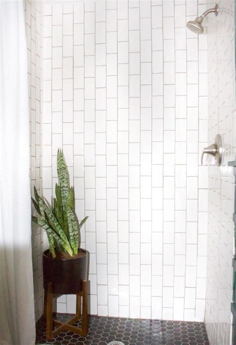 Moody Bathroom With Vertical Subway Tile