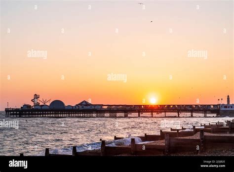 Windy Morning Sunrise Over The Pier At Herne Bay With The Foreground