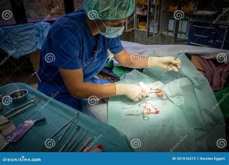 Surgeon Sutures A Small Wound On A Patient With Needle Holder And