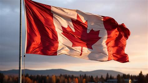 Premium Ai Image A Flag With A Maple Leaf On It Flies In The Sunset