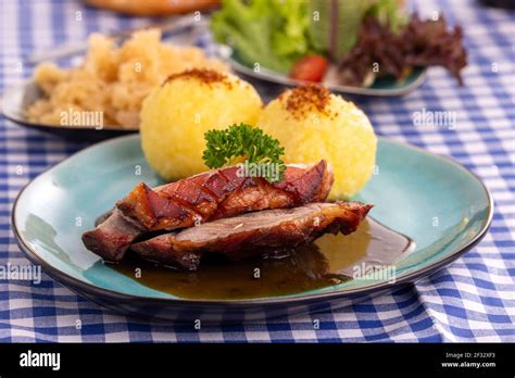 Bayerischer Schweinebraten Mit Kartoffelknodeln Hi Res Stock