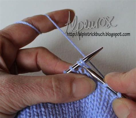 A Person Is Knitting With Scissors In Their Hand