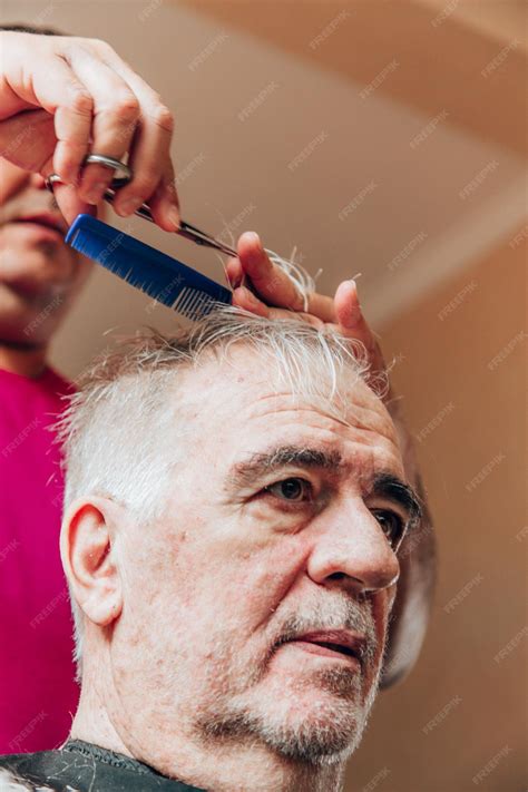 Premium Photo Old Man Getting A Haircut