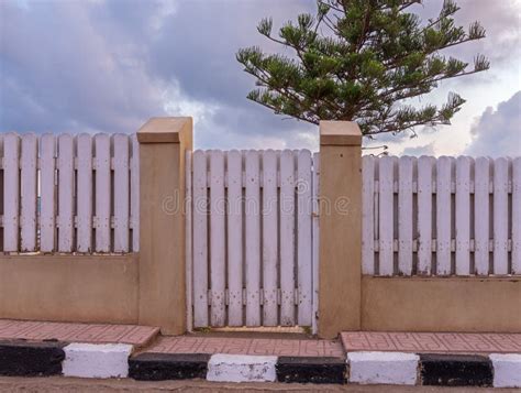 White Weathered Wooden Garden Gate and Fence with Background of Single ...