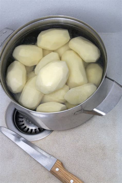 Peeled Potatoes In A Saucepan In A Kitchen Sink Stock Image Image Of