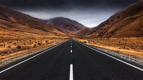 4K Ultra HD Wallpaper: Serene Man-Made Road Through Majestic Landscapes