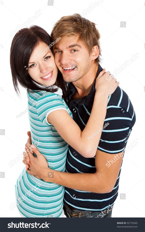 Young Happy Couple Love Smiling Looking At Camera Hug Each Other