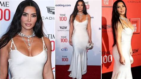 Kim Kardashian Looks Angelic As She Slips Her Heavenly Curves Into