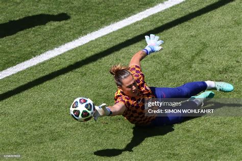 Bacelona's Spanish goalkeeper Cata Coll dives to intercept the ball ...