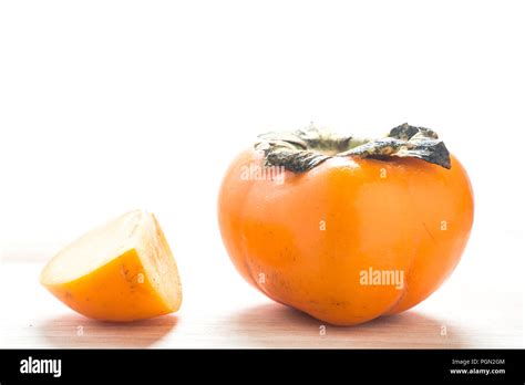 Persimmon On A White Background Persimmon Orange In Front View Stock