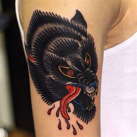 Old school style black wolf's head with bloody drops colored shoulder ...