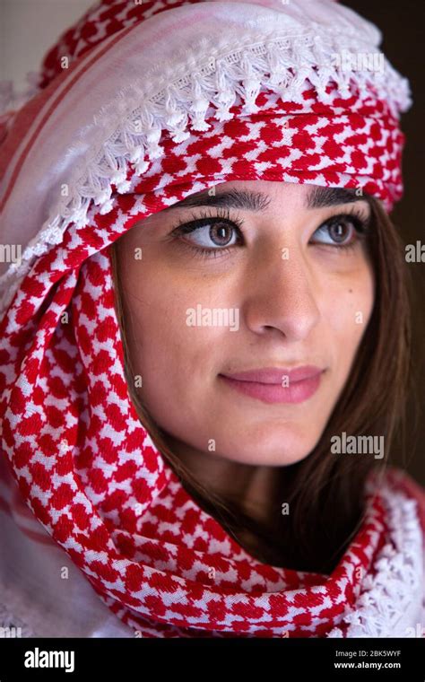 Young Jordanian Woman Wearing Traditional Keffiyeh Head Scarf At Jerash