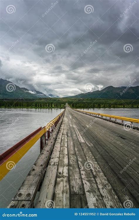 Bridge Over Susitna River Under the Clouds Stock Photo - Image of track ...