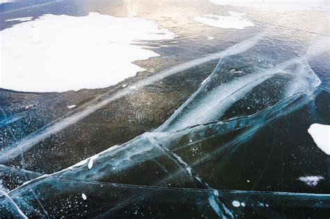 Cracked ice on the lake. stock photo. Image of lake, clear - 67303056