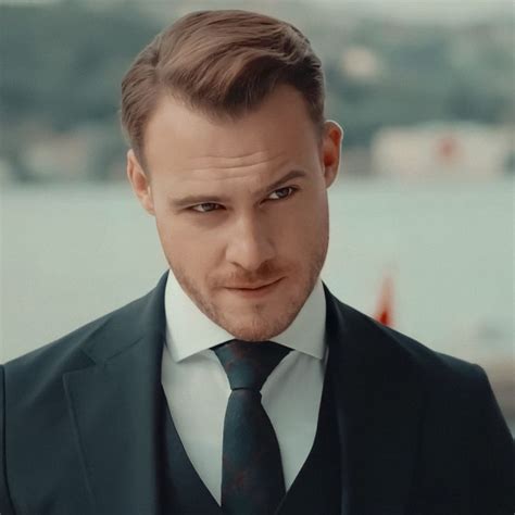 A Man In A Suit And Tie Looking At The Camera With An Intense Look On