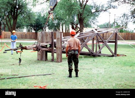 The Frame Of The Windmill Is Safely On The Ground And Is Being Prepared