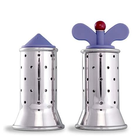 Two Salt And Pepper Shakers With Blue Tops On White Background One Has