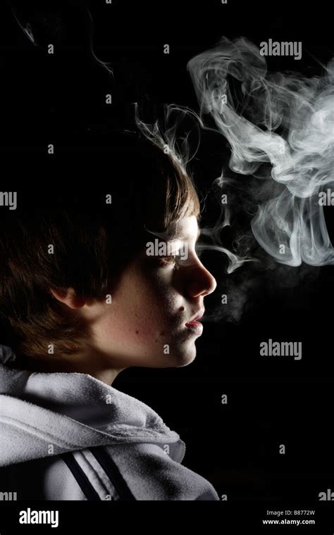 Boy smoking a cigarette Stock Photo - Alamy