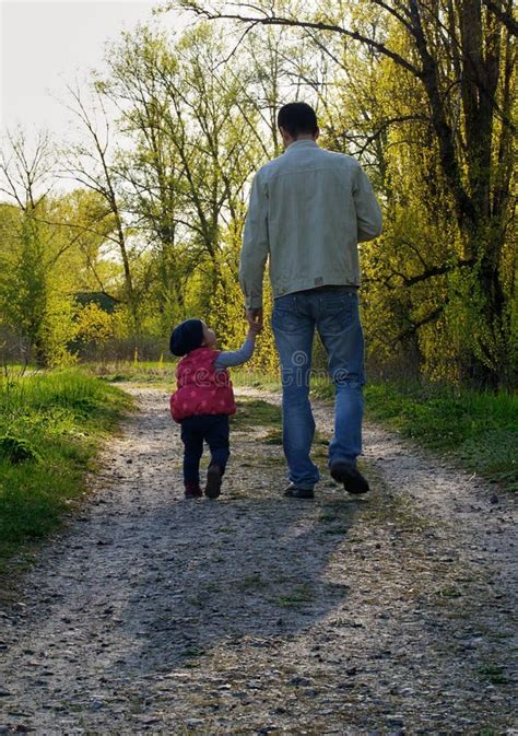 My Dad Father And Daughter Walk Down The Path Stock Photo Image Of