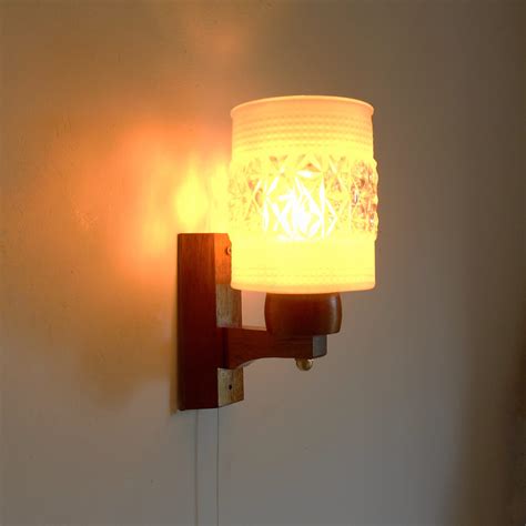 mid century modern danish teak wall lamp with a pull switch