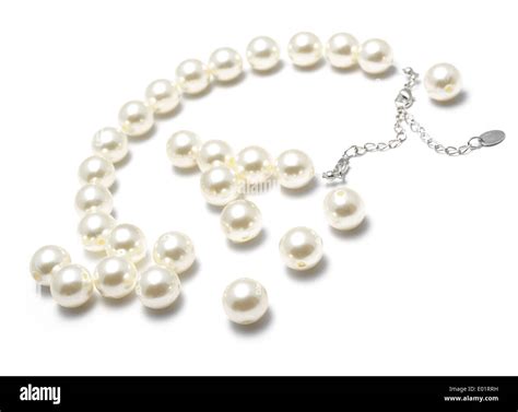 Broken String Of Pearls Cut Out On A White Background Stock Photo